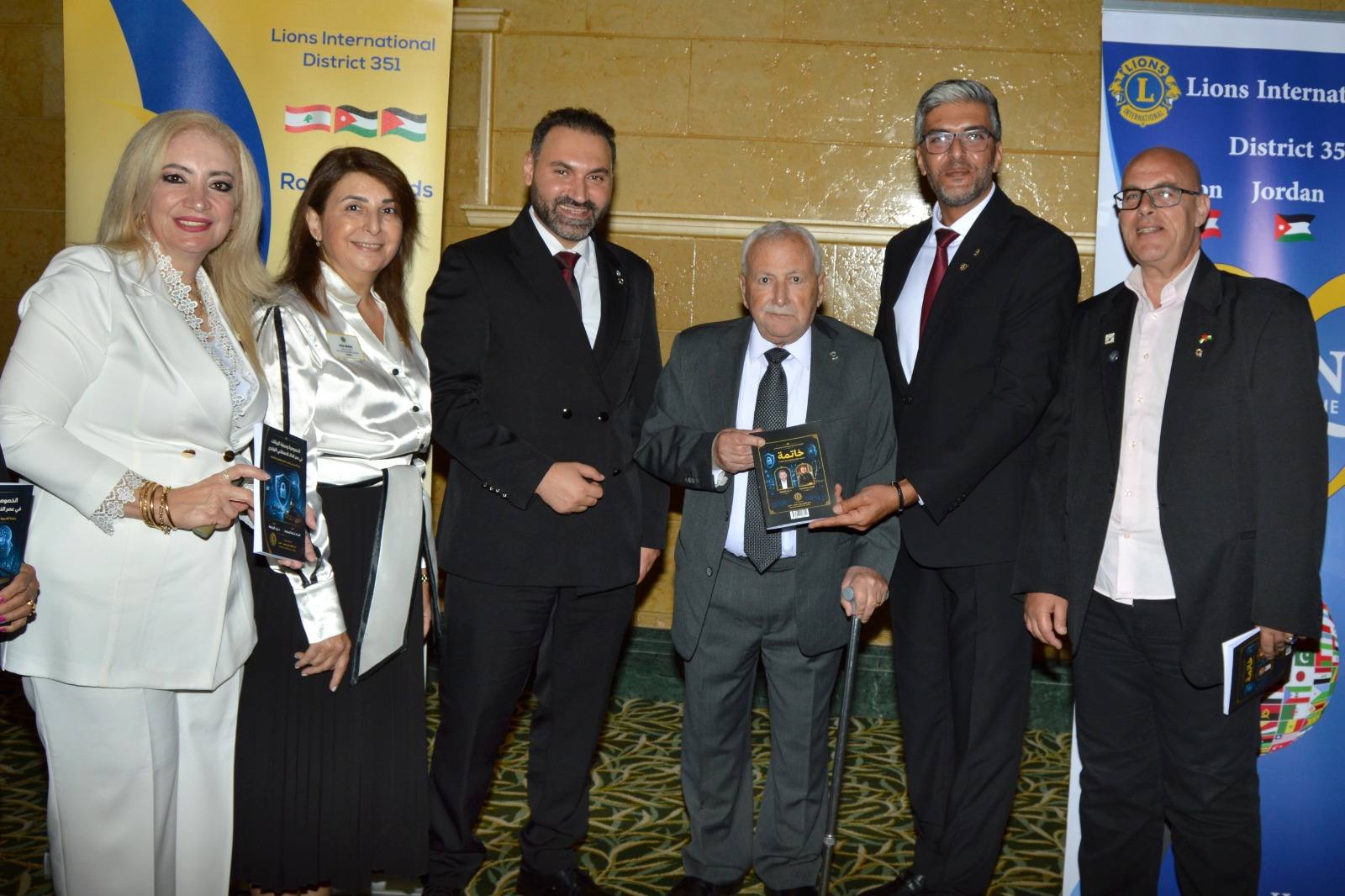 Group photograph of Amman Royal Swords Lions Club members and guests at the book launch